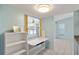 Bright dining nook featuring a built-in table and shelves near the kitchen at 3857 Sailmaker Ln, Holiday, FL 34691
