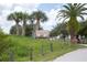 Anclote Gulf Park entrance sign surrounded by palm trees and lush green grass at 3857 Sailmaker Ln, Holiday, FL 34691