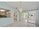 Bright and airy living space with views through to other rooms of the home at 3857 Sailmaker Ln, Holiday, FL 34691