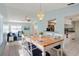 Open living space showcasing dining room, living room, and kitchen in an airy layout at 3857 Sailmaker Ln, Holiday, FL 34691