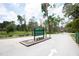 Key Vista Nature Park entrance with trees, an American flag, signage, and park information at 3857 Sailmaker Ln, Holiday, FL 34691