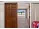 View of the pool from indoors, showing privacy and a view to the pool area at 3857 Sailmaker Ln, Holiday, FL 34691
