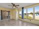 Enclosed sunroom with views of community pond at 3857 Sailmaker Ln, Holiday, FL 34691