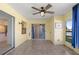 Enclosed sunroom with ceiling fan and sliding doors at 3857 Sailmaker Ln, Holiday, FL 34691