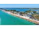Stunning aerial view capturing the coastal homes along the beach and the beautiful turquoise water at 4005 Casey Key Rd, Nokomis, FL 34275