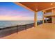 Covered patio offers ocean views and space for outdoor enjoyment at 4005 Casey Key Rd, Nokomis, FL 34275