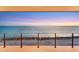 Balcony view of ocean with sunset at 4005 Casey Key Rd, Nokomis, FL 34275