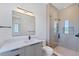 Modern bathroom featuring a sleek vanity, a frameless glass shower, and contemporary fixtures at 4005 Casey Key Rd, Nokomis, FL 34275