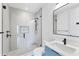 Modern bathroom featuring a sleek vanity, a frameless glass shower, and contemporary fixtures at 4005 Casey Key Rd, Nokomis, FL 34275