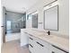 Bathroom with a shower, tile floor, granite counters, and updated fixtures at 4005 Casey Key Rd, Nokomis, FL 34275