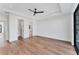 Bright bedroom boasts wood floors, a walk-in closet and an ensuite bath at 4005 Casey Key Rd, Nokomis, FL 34275