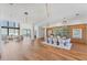 Bright dining area with modern lighting, contemporary furnishings, and ocean views at 4005 Casey Key Rd, Nokomis, FL 34275