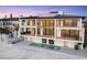 Stunning three-story beachfront home with balconies, pool, and spiral staircase at 4005 Casey Key Rd, Nokomis, FL 34275