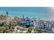 Elegant multi-story home with lush landscaping, a circular driveway, and a stunning ocean view at 4005 Casey Key Rd, Nokomis, FL 34275