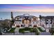 Beautiful home with a well-maintained lawn, elegant driveway, and a clear view of the ocean beyond at 4005 Casey Key Rd, Nokomis, FL 34275