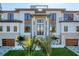 Contemporary two-story home with sleek lines, manicured lawn, and a welcoming entrance at 4005 Casey Key Rd, Nokomis, FL 34275