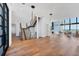 Grand foyer featuring modern staircase, high ceilings, and an abundance of natural light at 4005 Casey Key Rd, Nokomis, FL 34275
