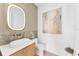 Stylish half bath featuring vessel sink, modern fixtures, and unique art at 4005 Casey Key Rd, Nokomis, FL 34275