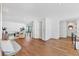 Bright and spacious hallway with hardwood floors, modern railing, and lots of natural light at 4005 Casey Key Rd, Nokomis, FL 34275