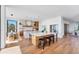 Spacious modern kitchen featuring a large center island, breakfast bar, sleek cabinetry, and modern appliances at 4005 Casey Key Rd, Nokomis, FL 34275