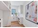Well-organized laundry room boasts ample cabinet space, modern sink, and attractive decor at 4005 Casey Key Rd, Nokomis, FL 34275