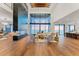 Bright and airy living room with hardwood floors, a modern fireplace, and expansive ocean views at 4005 Casey Key Rd, Nokomis, FL 34275