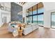 Elegant living room with a soaring fireplace, high ceilings, and ocean views at 4005 Casey Key Rd, Nokomis, FL 34275
