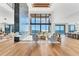 Bright, open-concept living room with soaring ceilings, a fireplace and ocean views at 4005 Casey Key Rd, Nokomis, FL 34275