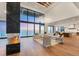 Open-concept living area with floor-to-ceiling windows offering breathtaking ocean views and modern furnishings at 4005 Casey Key Rd, Nokomis, FL 34275