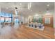 Expansive living and dining area boasting modern decor and panoramic ocean views through floor to ceiling glass windows at 4005 Casey Key Rd, Nokomis, FL 34275