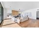 Spacious living room featuring hardwood floors, modern furniture, and ample natural light at 4005 Casey Key Rd, Nokomis, FL 34275