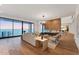 Bright living area with modern decor, fireplace, and ocean views at 4005 Casey Key Rd, Nokomis, FL 34275