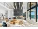 Open concept living space with modern decor, fireplace feature, and natural light at 4005 Casey Key Rd, Nokomis, FL 34275