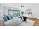 Beautiful bedroom features water view, sleek ceiling fan and modern decor at 4005 Casey Key Rd, Nokomis, FL 34275