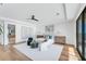 Bright primary bedroom featuring hardwood floors, modern decor, and lots of natural light at 4005 Casey Key Rd, Nokomis, FL 34275