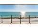 Stunning ocean view from a covered balcony with tile flooring and modern railings at 4005 Casey Key Rd, Nokomis, FL 34275
