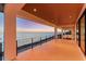 Spacious covered patio area showcasing stunning sunset views at 4005 Casey Key Rd, Nokomis, FL 34275
