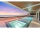 Luxury pool and spa overlooking the ocean, perfect for relaxation and entertaining, at sunset at 4005 Casey Key Rd, Nokomis, FL 34275