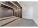 Modern theater room with tiered seating and custom lighting create an immersive entertainment experience at 4005 Casey Key Rd, Nokomis, FL 34275