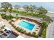 Overhead shot of the sparkling community pool with chairs and tables for relaxing and lounging at 4015 Bayshore Blvd # 11A, Tampa, FL 33611