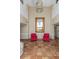 Lobby with terracotta tile flooring, statement lighting, red chairs, and decorative mirror at 4015 Bayshore Blvd # 11A, Tampa, FL 33611