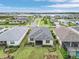 Wide aerial view displaying the property in a well-planned community with landscaping, water views, and neighborhood streets at 42211 Edgewater Dr, Punta Gorda, FL 33982