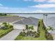 Gorgeous aerial shot of the home with waterfront views, highlighting the well-maintained landscaping and neighborhood at 42211 Edgewater Dr, Punta Gorda, FL 33982