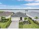Stunning aerial view of the property, showcasing its waterfront location and meticulously landscaped front yard at 42211 Edgewater Dr, Punta Gorda, FL 33982