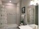 Bright bathroom with a tiled shower and a sleek, white vanity at 42211 Edgewater Dr, Punta Gorda, FL 33982