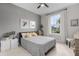 Comfortable bedroom with grey walls, a ceiling fan, and bright natural light at 42211 Edgewater Dr, Punta Gorda, FL 33982