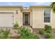 Inviting front exterior with a two-car garage, neatly kept lawn, and a walkway leading to the charming front door at 42211 Edgewater Dr, Punta Gorda, FL 33982