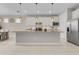 Well-equipped kitchen with a large center island, modern appliances, and seamless connectivity to the dining and living areas at 42211 Edgewater Dr, Punta Gorda, FL 33982