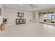 Open living area featuring sliding glass doors to the screened patio and a stylish console table against a decorative wall at 42211 Edgewater Dr, Punta Gorda, FL 33982