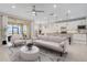 Bright and airy living room with contemporary furnishings, a view of the water, and a seamless connection to the kitchen at 42211 Edgewater Dr, Punta Gorda, FL 33982